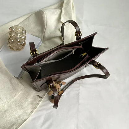 Mirella | Bolso con dijes